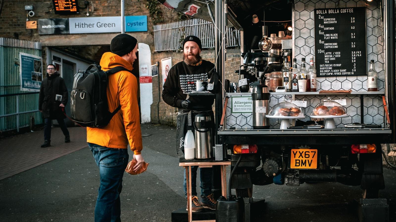 Isaac serving specialty coffee at the Bolla Bolla tuk